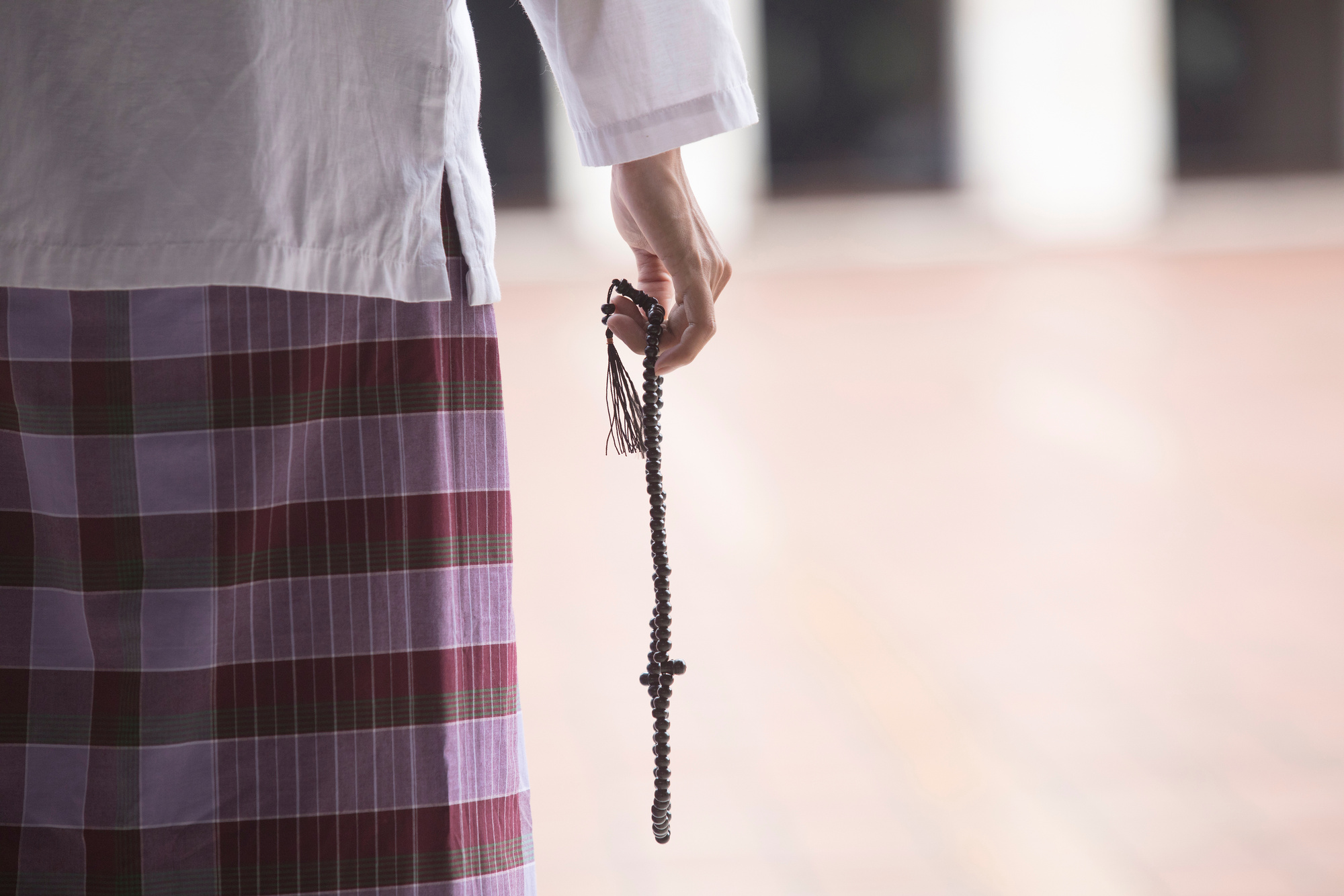 Muslim Man Doing Zikr with Beads